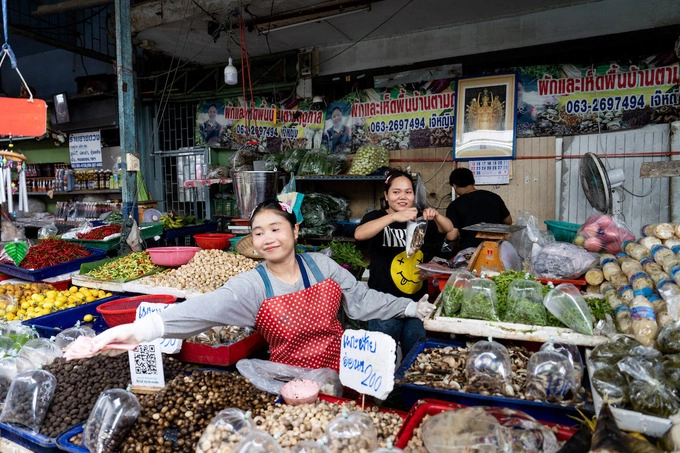 Vegetable sellers manage customers at Khlong Toey wet market in Bangkok, Thailand, on June 3, 2025. Photo by AFP